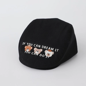 Close-up of black cotton beret featuring three cute bears and motivational embroidery text