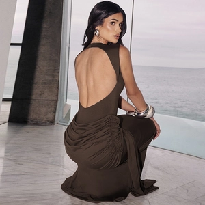 Detail of dark brown backless maxi dress with cutout design and ruched hip detail