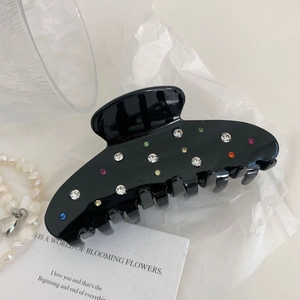 Elegant black resin hair claw with colorful rhinestones in a French vintage style