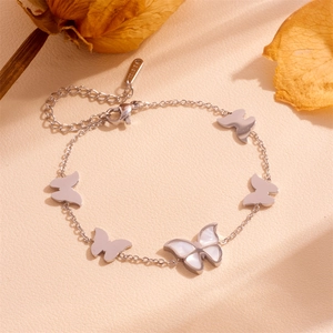 Macro detail of silver stainless steel butterfly bracelet with white shell inlay