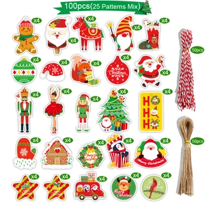 Close-up of 100pcs Christmas kraft paper gift tags with 25 designs and hanging ropes