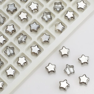 Macro shot of 8mm silver star-shaped glass beads for DIY jewelry making and craft projects