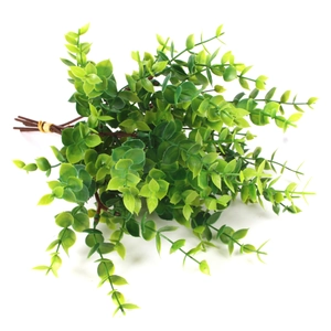 Detail of artificial green eucalyptus leaves with seeds and realistic stem texture