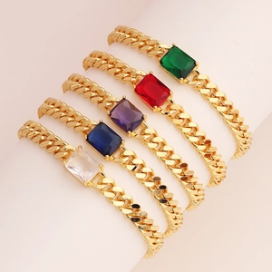 Detail of five gold-plated Cuban link bracelets with colorful rectangular zircon stones