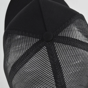 Detailed macro view of black mesh baseball cap showing top button and breathable texture
