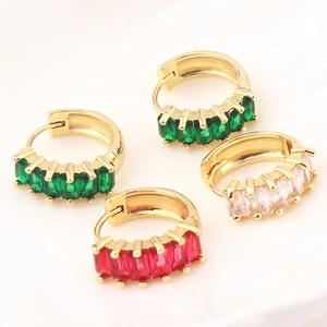 Minimalist gold hoop earrings with green, red, and clear cubic zirconia gemstones