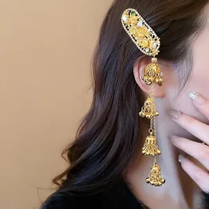 Ethnic gold hair clip with rhinestone flowers and long jhumka bell tassels
