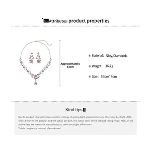 Detail of luxury gold alloy jewelry set with purple zircon floral vine and teardrop design