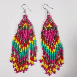 Bohemian multi-layer seed bead earrings with colorful geometric tassel pattern on white back