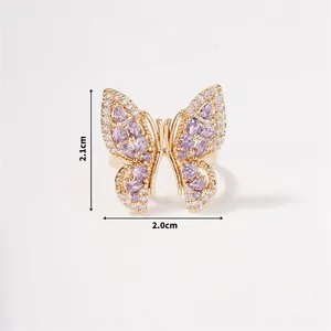 Detailed view of butterfly ring dimensions showing gold plating and purple cubic zirconia