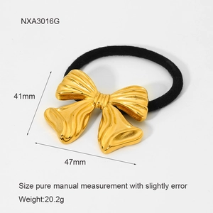 Detail view of golden bow hair accessory with dimensions 41mm by 47mm and weight 20.2g