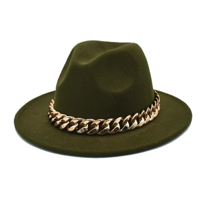 Detail of olive green fedora hat featuring a chunky rose gold chain and flat brim