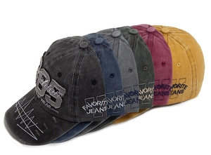 Close-up of vintage washed cotton baseball caps with 85 embroidery in six retro colors