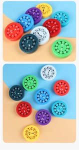 Macro detail of educational math spinner gears showing numbers and arithmetic symbols