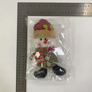Detail view of plush snowman ornament showing 22cm height measurement with ruler