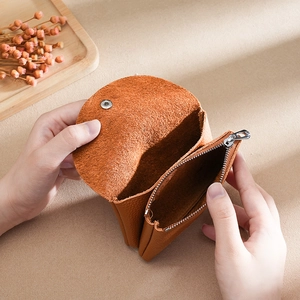 Genuine leather coin purse in brown with snap button and zipper closure for women