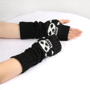 Knitted fingerless skull gloves in black acrylic, warm winter arm sleeves for women