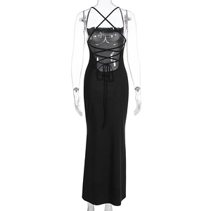 Detail of cross tie-up straps and open back design on a black satin maxi dress