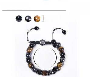 Detail of 10mm tiger eye, hematite, and agate beads with adjustable braided cord and Om charm