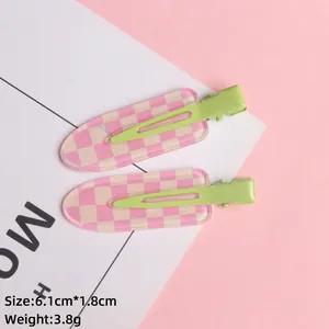 Pink checkered hair clip set with green metal base, dimensions 6.1cm by 1.8cm