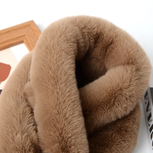 Close-up detail of soft brown faux rabbit fur scarf showing plush texture and warmth