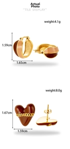 Detail view of retro titanium steel heart earrings with dimensions and weight specs