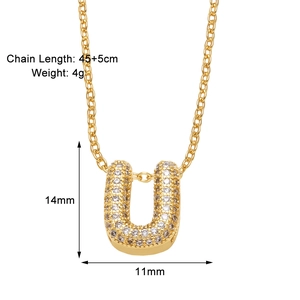 Detail view of gold letter U pendant necklace with zircon inlay and dimensions