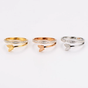 Three-tone butterfly rings with sparkling zircon pavé and intertwined bands on white