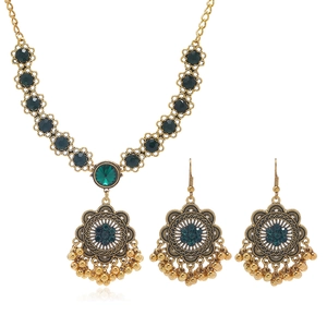 Vintage luxury jewelry set with green gemstones, bronze necklace and drop earrings