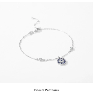 Macro shot of silver Evil Eye bracelet with blue crystal pavé and clear gemstones
