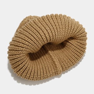 Close-up detail of the camel thick ribbed knit pattern on a warm slouchy beanie hat