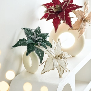 Velvet artificial Christmas flowers with glitter edges in a ceramic vase for home decor