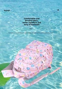 Close-up of waterproof pink school bag fabric with colorful rainbow and heart patterns