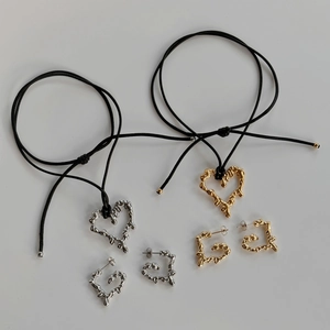 Boho lava heart jewelry set with fluid metal texture necklaces and earrings