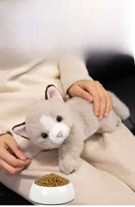 Detail of plush Persian cat toy featuring realistic blue eyes and soft faux fur texture
