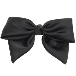 Elegant large black satin bow hair clip for women with soft silk luster on a white background