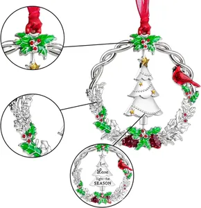 Detail of silver Christmas wreath ornament with 2023 tree and holiday message engraving