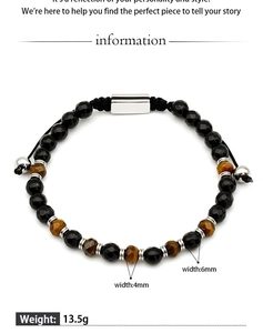 Detail of 4mm and 6mm beaded bracelet with faceted tiger eye stone and black beads