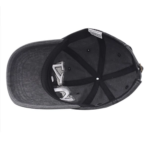Detail view of cotton baseball cap interior featuring adjustable metal buckle and wash label