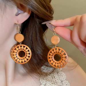 Vintage wood hollow sun round clip-on earrings for women in bohemian retro style