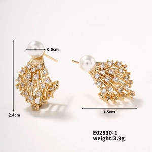 Detail view of gold pearl earrings with zirconia settings showing 2.4cm height and dimensions