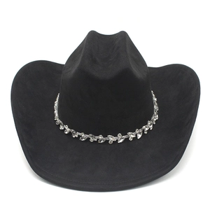 Detailed view of black suede cowboy hat with sparkling rhinestone-embellished band decoration