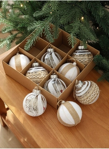 Detailed view of nine rustic 8cm Christmas ball ornaments in a kraft box set decoration
