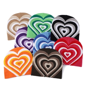 Knit beanie collection with stylish heart patterns in various vibrant color combinations