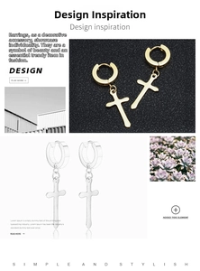 Macro detail of gold and silver cross dangle hoop earrings in stainless steel finish