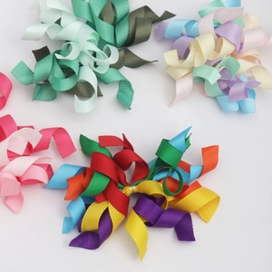 Detailed view of colorful handmade ribbon bows for gift boxes and DIY holiday decorations