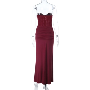Detailed back view of deep red evening gown showing lace bodice and pleated waist