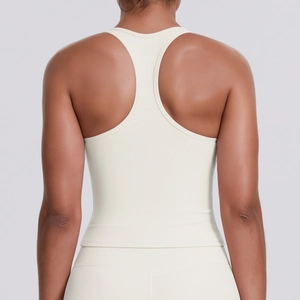 Racerback sports top in off-white fabric with a fitted cut and seamless matte texture