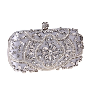 Elegant silver satin evening clutch with faux crystals and pearls for formal events