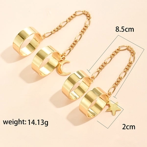Close-up of gold chain ring bracelet with star and crescent moon charms, weight 14.13g